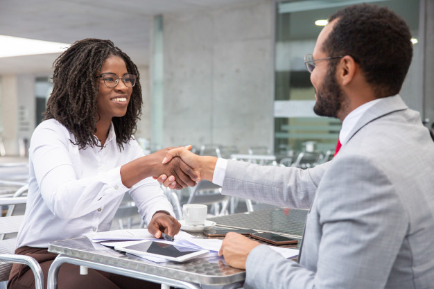 Trident processing services employee and customer handshake